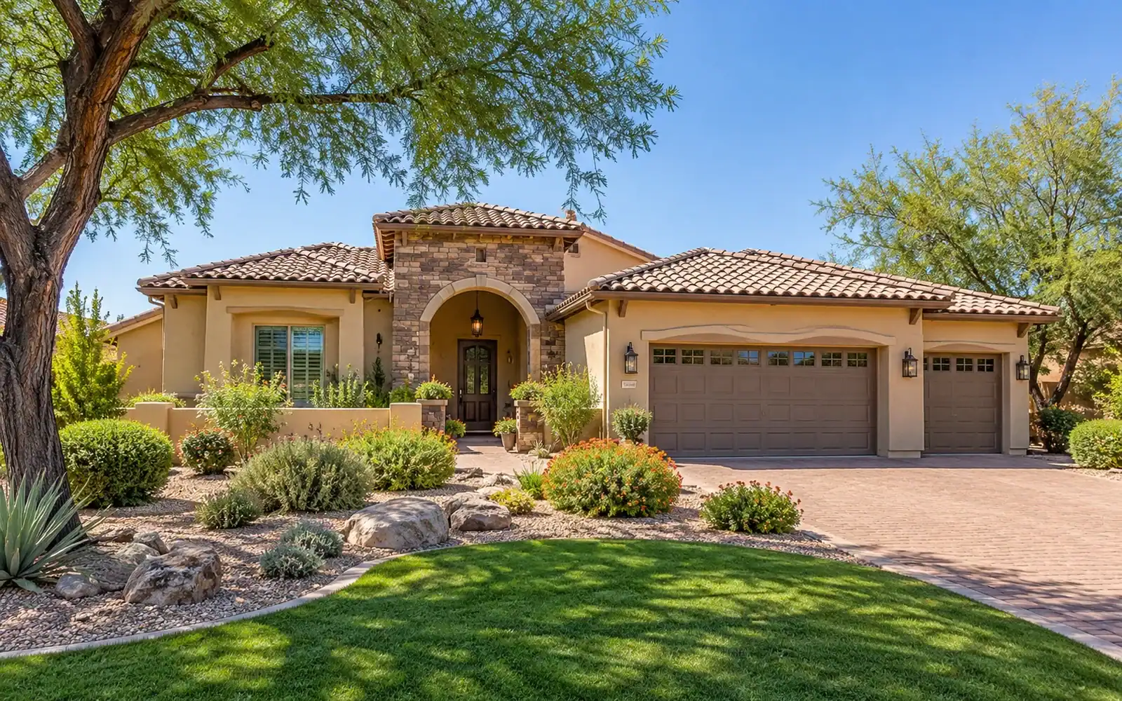 Mesa home with a tile roof and desert landscaping