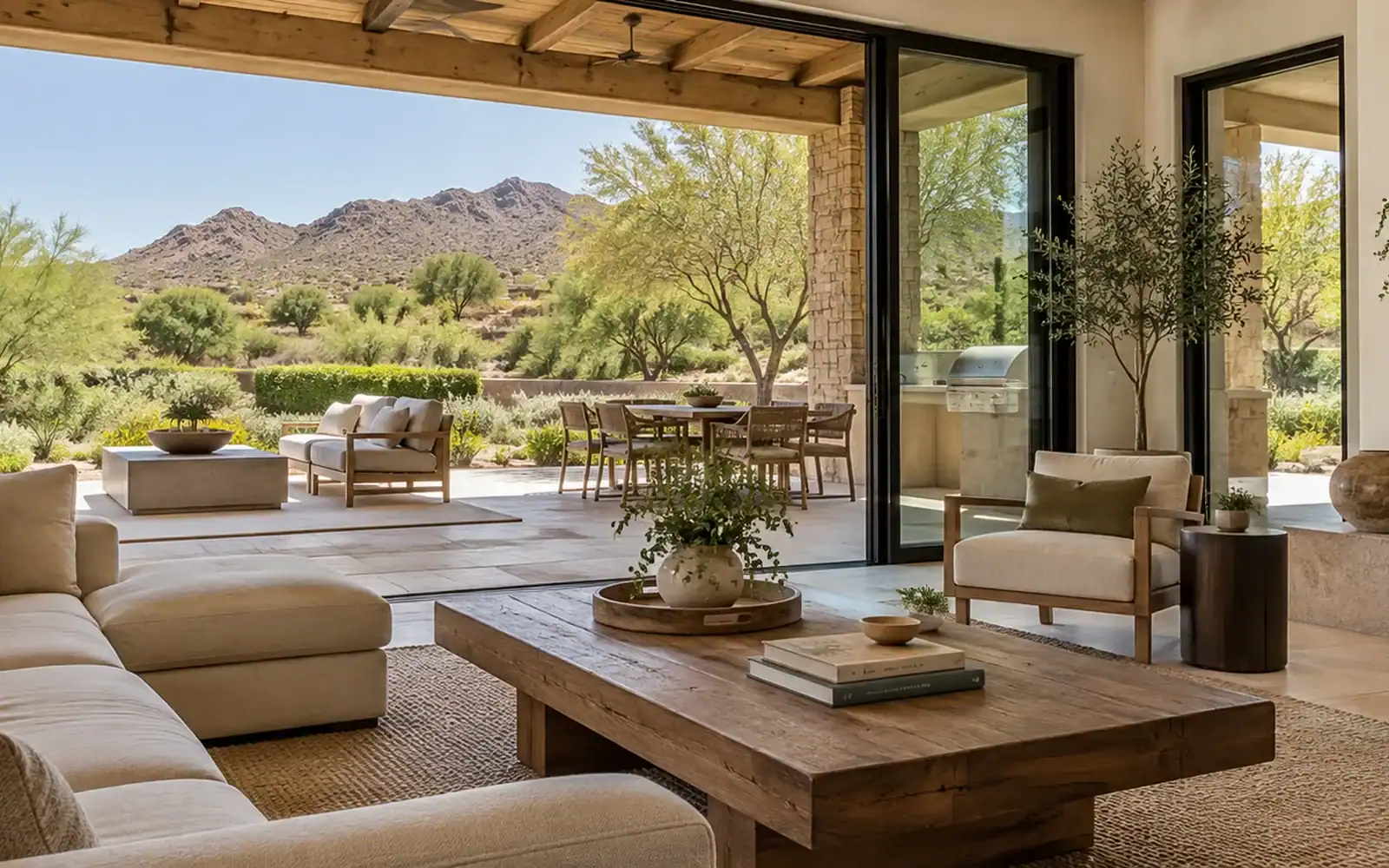 Paradise Valley living room opening to a patio with mountain views